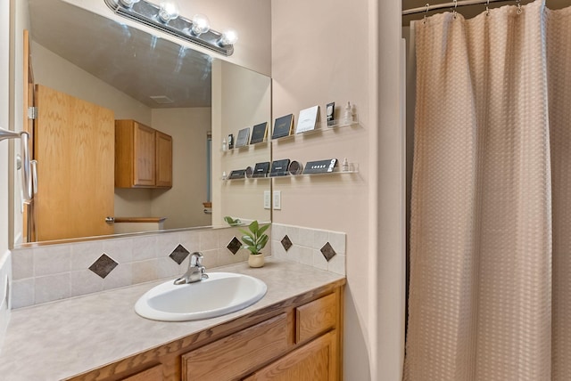 3518 S Woodlawn Dr, Spokane Valley, WA 99206 - bathroom featuring decorative backsplash, vanity, and a shower with curtain