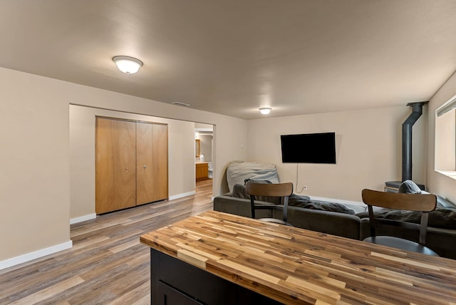 3518 S Woodlawn Dr, Spokane Valley, WA 99206 - living area with wood finished floors and a wood stove