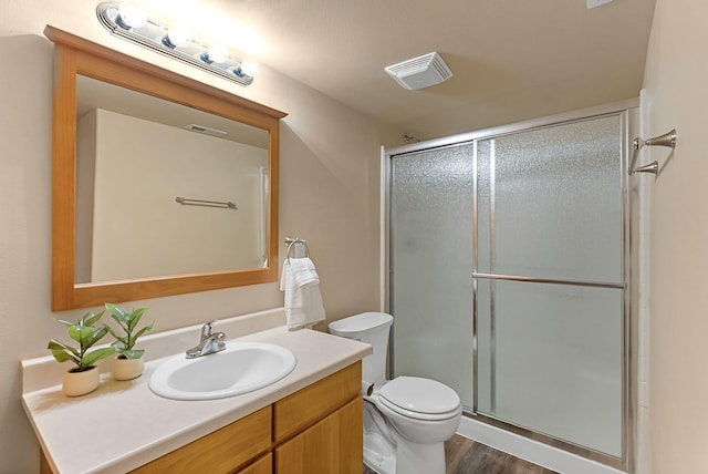 3518 S Woodlawn Dr, Spokane Valley, WA 99206 - bathroom featuring vanity, a stall shower, and wood finished floors