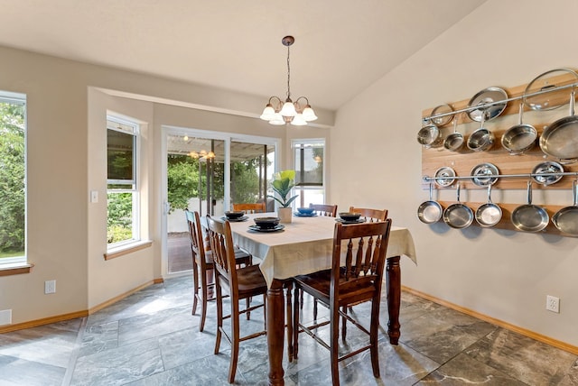 3518 S Woodlawn Dr, Spokane Valley, WA 99206 - dining area featuring a chandelier, plenty of natural light, vaulted ceiling, and stone finish floors