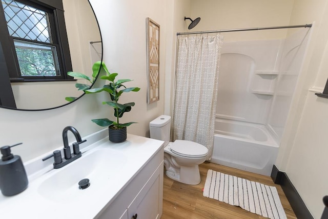 2514 4th Ave, Spokane, WA 99202 - full bathroom featuring wood finished floors, vanity, and shower / tub combo