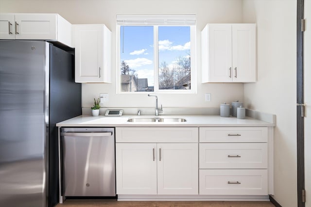2519 N Columbus Rd, Spokane, WA 99207 - kitchen featuring appliances with stainless steel finishes, white cabinets, and light countertops