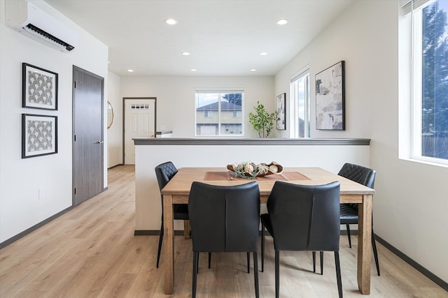 2519 N Columbus Rd, Spokane, WA 99207 - dining room featuring a wall mounted AC, light wood finished floors, and recessed lighting