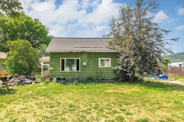 1111 W Main Ave, Chewelah, WA 99109 - back of house featuring roof with shingles
