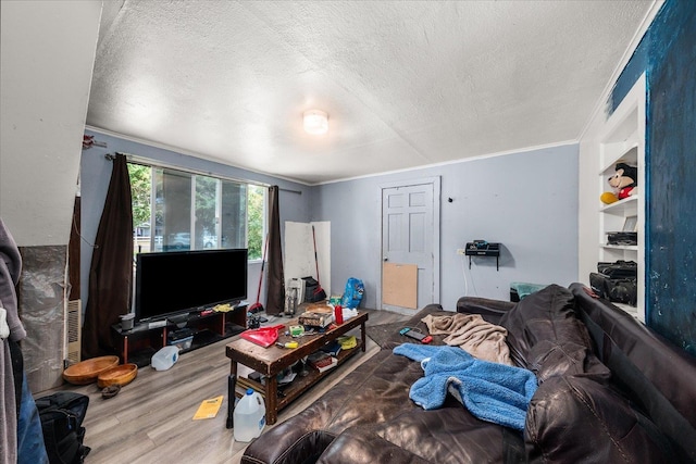 1111 W Main Ave, Chewelah, WA 99109 - living room with a textured ceiling, wood finished floors, and crown molding
