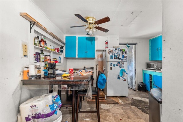 1111 W Main Ave, Chewelah, WA 99109 - kitchen featuring freestanding refrigerator and a ceiling fan