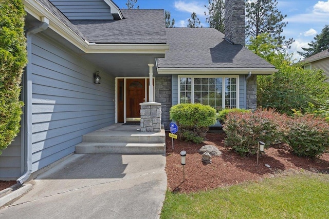 15116 N Edencrest Dr, Spokane, WA 99208 - entrance to property with roof with shingles, a chimney, and stone siding