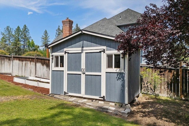 15116 N Edencrest Dr, Spokane, WA 99208 - view of shed with a fenced backyard and a vegetable garden