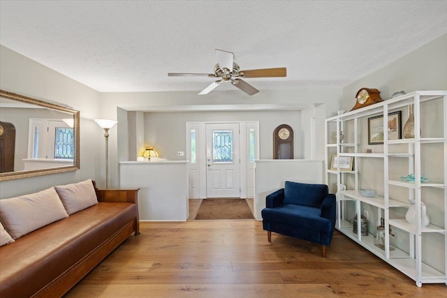 3410 S Napa St, Spokane, WA 99203 - living area featuring wood-type flooring, a textured ceiling, and ceiling fan