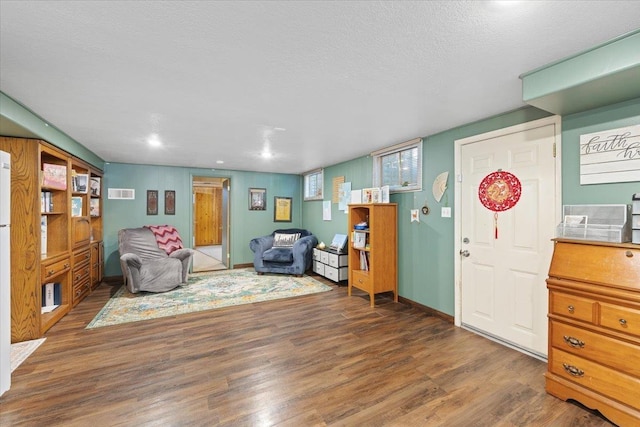 3410 S Napa St, Spokane, WA 99203 - living area featuring wood finished floors, a textured ceiling, and recessed lighting