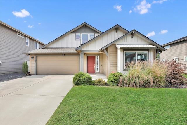 19851 E Kalama Ave, Liberty Lake, WA 99016 - view of front of property with board and batten siding, an attached garage, concrete driveway, a front lawn, and roof with shingles
