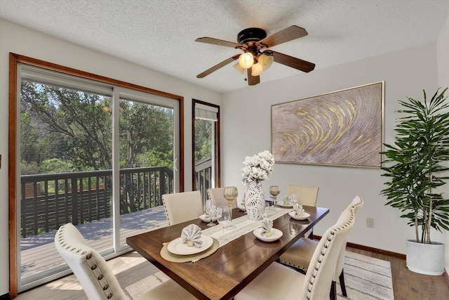 14417 N Dakota Rd, Spokane, WA 99208 - dining area featuring wood finished floors, a ceiling fan, and a textured ceiling
