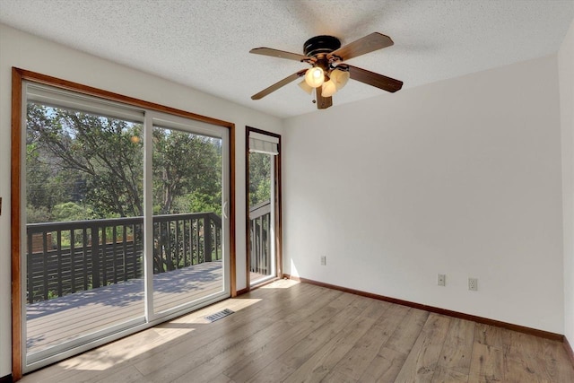 14417 N Dakota Rd, Spokane, WA 99208 - empty room with hardwood / wood-style floors, ceiling fan, and a textured ceiling