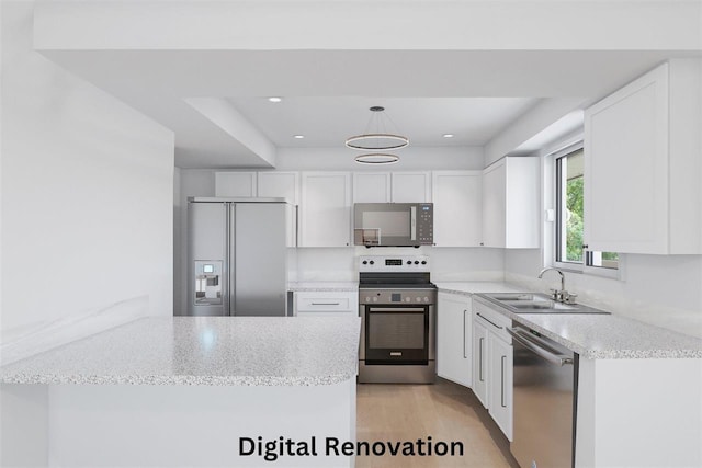 14417 N Dakota Rd, Spokane, WA 99208 - kitchen featuring appliances with stainless steel finishes, white cabinetry, light stone counters, hanging light fixtures, and recessed lighting