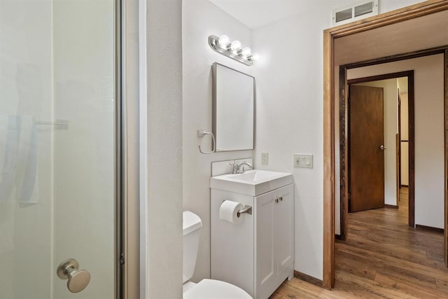 14417 N Dakota Rd, Spokane, WA 99208 - full bath featuring wood finished floors, vanity, and a shower
