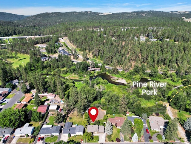 14417 N Dakota Rd, Spokane, WA 99208 - aerial overview of property's location featuring a mountain backdrop and nearby suburban area