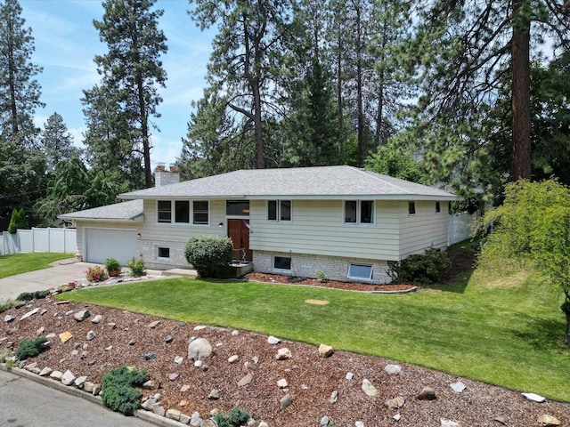 9405 N Normandie Ln, Spokane, WA 99218 - bi-level home with driveway, an attached garage, and a chimney