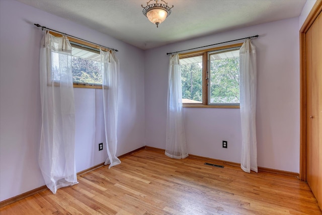 9405 N Normandie Ln, Spokane, WA 99218 - unfurnished room featuring light wood-style floors