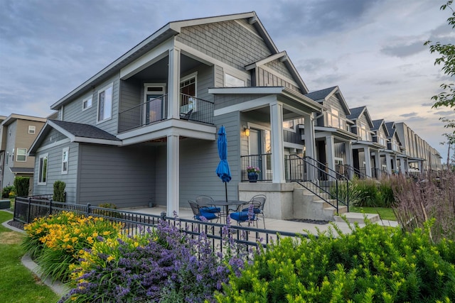 2303 W Bridge Ave, Spokane, WA 99201 - view of property exterior with a balcony, a patio area, and a residential view