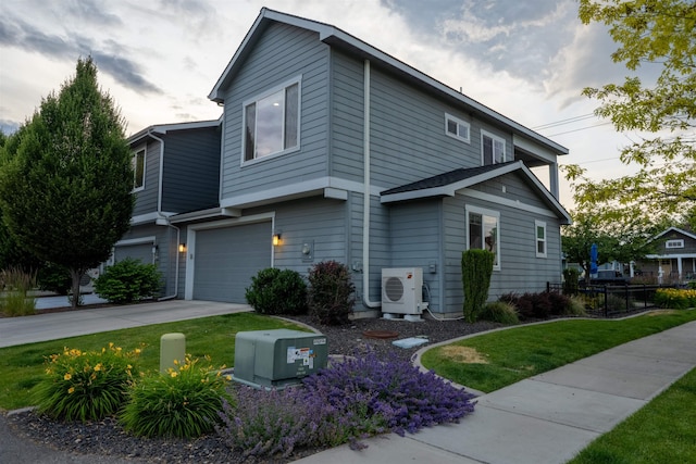 2303 W Bridge Ave, Spokane, WA 99201 - view of front of house featuring an attached garage, driveway, and a front lawn