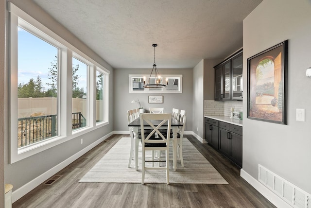4513 S Crows Nest Ln, Spokane, WA 99206 - dining space featuring a chandelier and dark wood-type flooring