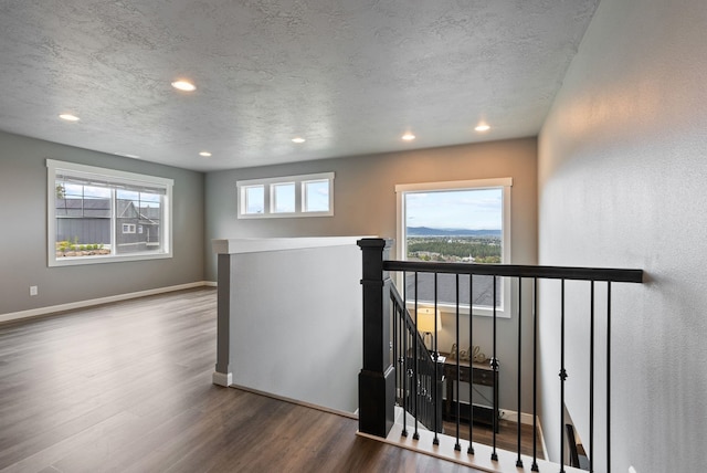 4513 S Crows Nest Ln, Spokane, WA 99206 - unfurnished room with wood finished floors, recessed lighting, and a textured ceiling