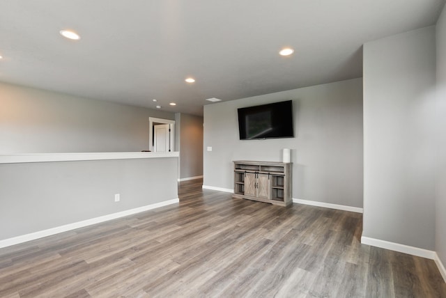 4513 S Crows Nest Ln, Spokane, WA 99206 - unfurnished living room featuring wood finished floors and recessed lighting