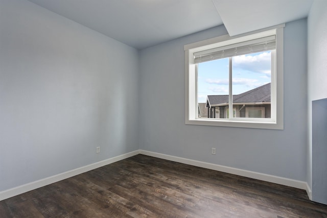 4513 S Crows Nest Ln, Spokane, WA 99206 - spare room featuring baseboards and dark wood-style flooring