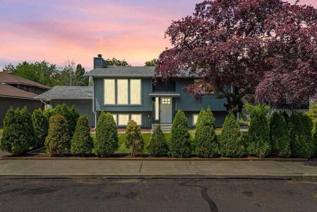 7721 N Wilding Dr, Spokane, WA 99208 - split foyer home featuring a chimney