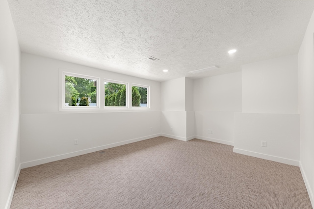 7721 N Wilding Dr, Spokane, WA 99208 - carpeted empty room with a textured ceiling and recessed lighting