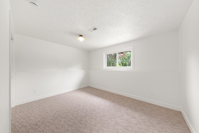 7721 N Wilding Dr, Spokane, WA 99208 - carpeted empty room featuring a smoke detector and a textured ceiling