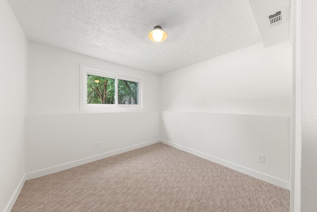 7721 N Wilding Dr, Spokane, WA 99208 - carpeted empty room with a textured ceiling and baseboards