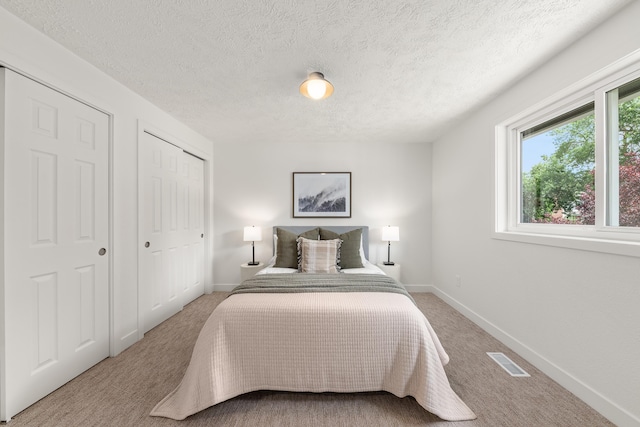 7721 N Wilding Dr, Spokane, WA 99208 - bedroom featuring carpet flooring and a textured ceiling