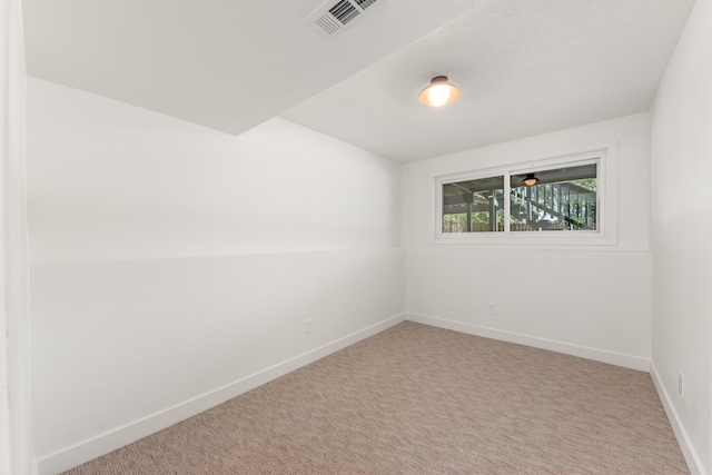 7721 N Wilding Dr, Spokane, WA 99208 - spare room featuring baseboards and carpet