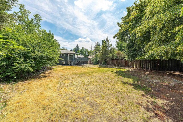 7721 N Wilding Dr, Spokane, WA 99208 - view of yard with stairway and a wooden deck