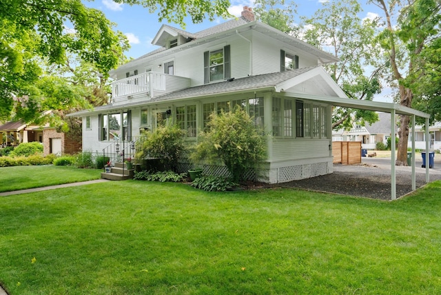 1315 N Hollis St, Spokane, WA 99201 - view of front of house featuring a balcony, roof with shingles, a chimney, a front yard, and a sunroom