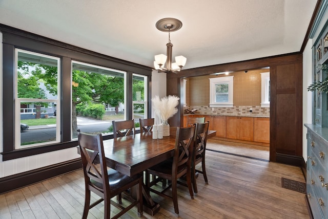 1315 N Hollis St, Spokane, WA 99201 - dining space featuring a chandelier and light wood-style flooring