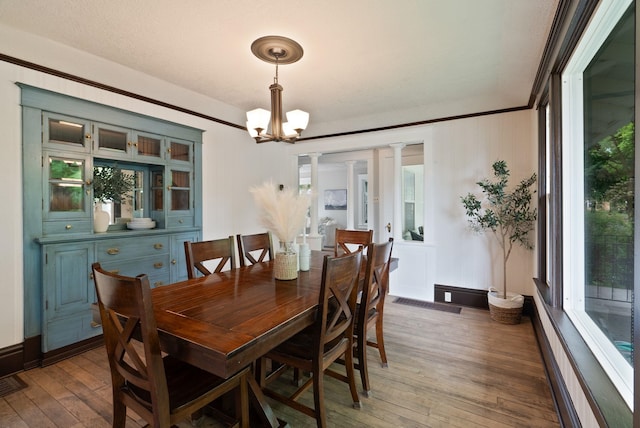 1315 N Hollis St, Spokane, WA 99201 - dining space with hardwood / wood-style flooring, a chandelier, and crown molding
