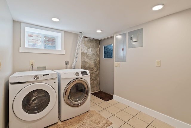 1315 N Hollis St, Spokane, WA 99201 - laundry area with electric panel, washing machine and dryer, and light tile patterned flooring