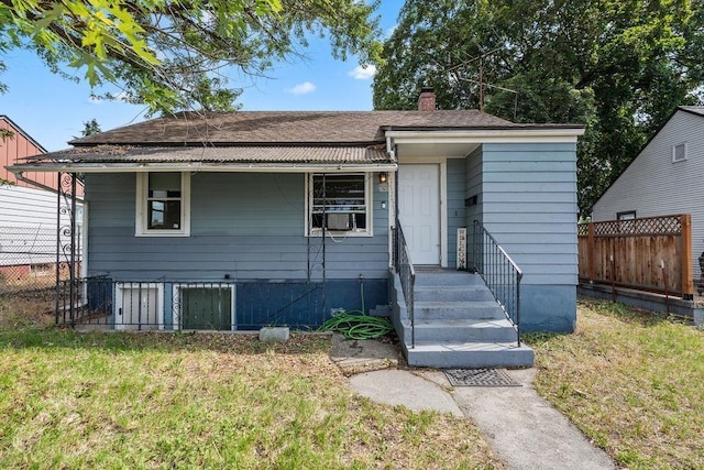 1630 E Broad Ave, Spokane, WA 99207 - view of front of home featuring a chimney, cooling unit, and a shingled roof