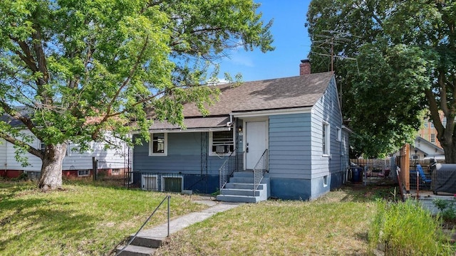 1630 E Broad Ave, Spokane, WA 99207 - view of front of house featuring a shingled roof, a chimney, and entry steps
