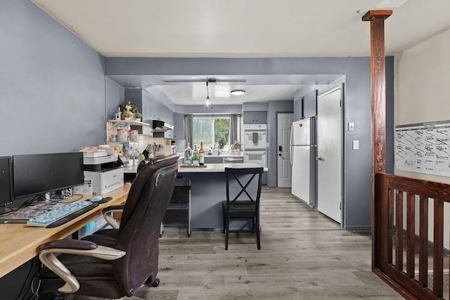 1630 E Broad Ave, Spokane, WA 99207 - office with light wood-style flooring and a sink