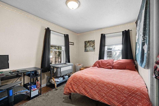 1630 E Broad Ave, Spokane, WA 99207 - bedroom featuring multiple windows and wood finished floors