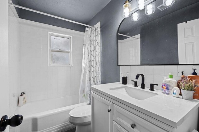 1630 E Broad Ave, Spokane, WA 99207 - bathroom with vanity, shower / tub combo with curtain, and tasteful backsplash