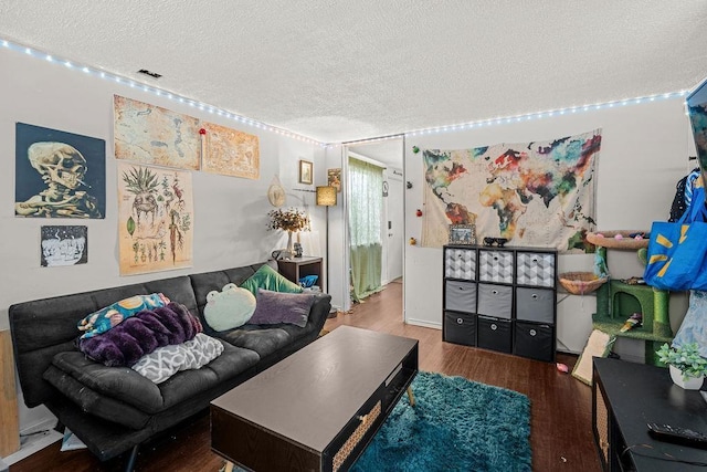 1630 E Broad Ave, Spokane, WA 99207 - living room featuring a textured ceiling and wood finished floors