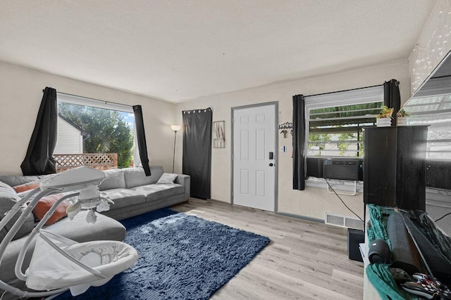 1630 E Broad Ave, Spokane, WA 99207 - living room featuring wood finished floors and cooling unit