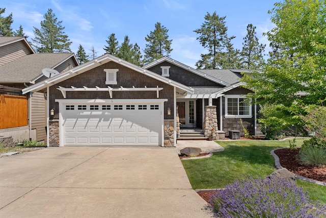 718 W Qualchan Ln, Spokane, WA 99224 - craftsman-style home featuring stone siding, an attached garage, concrete driveway, a front lawn, and a shingled roof