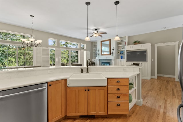 718 W Qualchan Ln, Spokane, WA 99224 - kitchen with dishwasher, a fireplace, a ceiling fan, and healthy amount of natural light