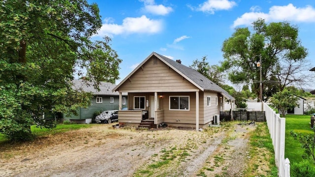 4505 E 5th Ave, Spokane Valley, WA 99212 - bungalow featuring covered porch and dirt driveway