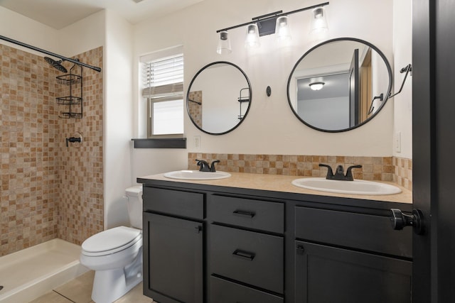 1819 N Center Ln, Spokane Valley, WA 99212 - full bathroom featuring double vanity, a tile shower, backsplash, and tile patterned flooring